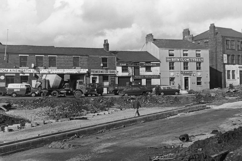 A familiar line of property in Market Street, Preston, set to disappear in 1968. In the foreground, the new ring road, showing clearly the central reservation of the dual carriageway