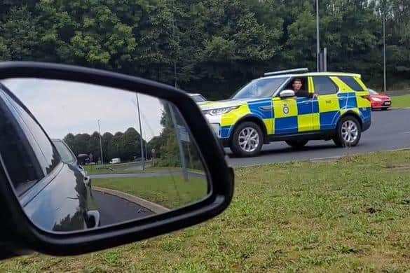 At one point in the video, a police officer escorting the Army trucks yells at a passenger filming the convoy from their car to “put your phone away!”. Pic credit: @Craftycutteruk