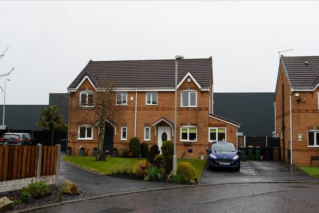 Some of the warehouses loom over newly built homes valued at around £350,000