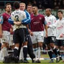 Brian O'Neil is held back by PNE physio Andrew Balderston in the game at West Ham