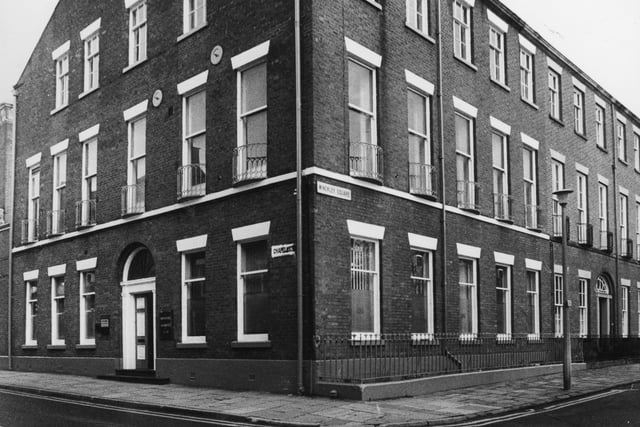In 1986, when this image was taken, a row broke out when Britannic Assurance, who occupied the building, painted the premises in Winckley Square a bright blue colour. The building on the corner of Chapel Street sits in a conservation area