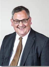 Cllr Adrian Lowe said a "strong message" needed to be sent to hospital bosses about building before getting permission
