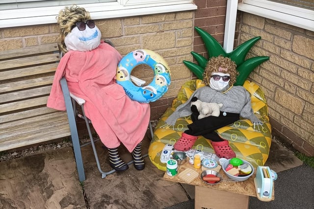 Scarecrows chilling by the pool