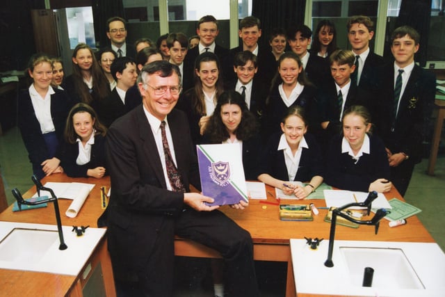 The good conduct and attitude to learning by youngsters at All Hallows RC High School, Penwortham, were singled out for praise by inspectors from the Government's Office for Standards in Education. Pictured: Delighted head Michael Flynn and pupils at All Hallows with the report in 1994