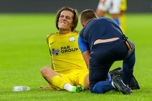 Alvaro Fernandez receives treatment at Huddersfield.
