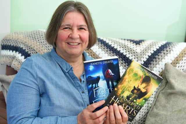 Preston author Jeanette Greaves with both her published books on all things werewolf