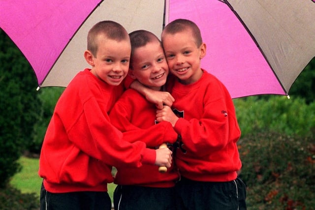Triplets (from left) Josh, Jacob and Luke Tapper getting used to the Preston weather while on holiday from Saudi Arabia