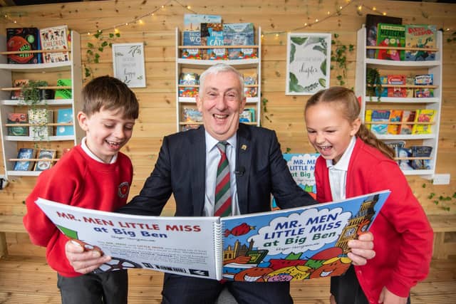 Balshaw Lane Community Primary School pupils Al Mellingwood and Ella Quinn get ready to read