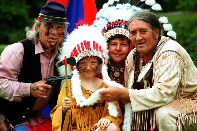 Beaver Adam Whybro, six, of New Longton Beaver Scouts, near Preston was made chief for a day when Indian Jack (Jack Welding) and his tribe of real Indians from Lytham St. Annes, including Running Dog (Richard Gawn) on the far left and Sitting Bull (Darrell Allan) second right visited the New Longton reservation to celebrate the Beavers tenth birthday in 1996