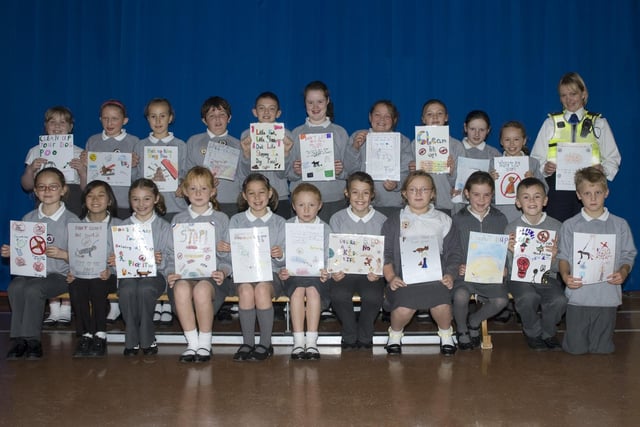 These Larkholme Primary School pupils from Fleetwood all took part in a poster competition warning about the dangers of dog fouling, which can cause blindness. They are pictured with police community support officer Jeanette Ashurst