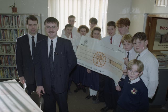 Garry Quinn, assistant manager of Midland Bank, Leyland (left) and Mike Brennan, area schools co-ordinator for iIdland Bank with (from left) Stephen Presler, 15, Chris Hart, 15, Lynne Fender, 15, Andrew Terry, 16, Lorna Goulding, 15, Nick Pollit, 15, Jonathon Gee, 16, Paul Hearne, 13, Alex Dunnett, 13, and Lee Houghton, 11. The pupils from Southlands High School in Chorley raised £7,337 for Children in Need