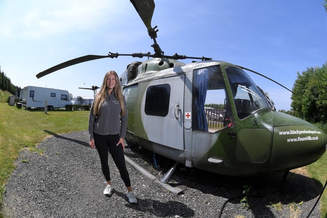 Katie Lewin at Ream Hills Holiday Park and the helicopter - one of the most unusual places to sleep in Lancashire