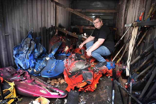 Photo Neil Cross; Jonathan McElhinney of Euxton Canoe Club, surveys the remains after the arson attack