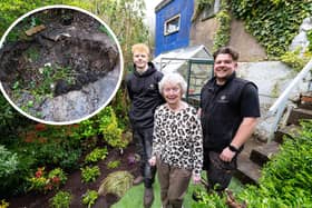 Dorothy Rigby was delighted by the generosity of Nick Whittle (right) and Rob Smith, from NFW Landscapes and Paving in Chorley, who filled in the sinkhole (inset) that her dominated her back garden since late last summer