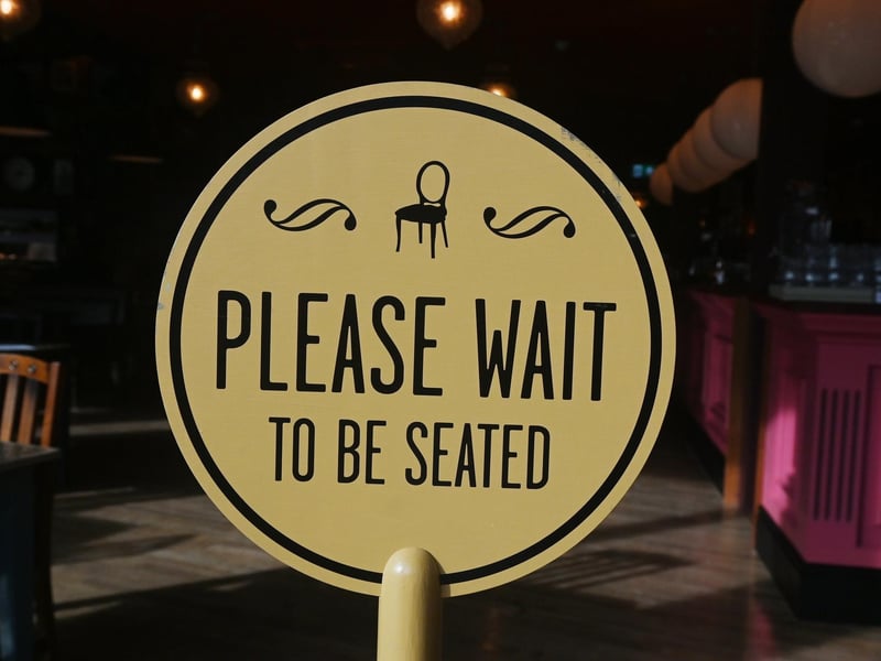 Please wait to be seated.