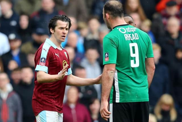 Matt Rhead and Joey Barton exchange words during The Emirates FA Cup Fifth Round match between Burnley and Lincoln City on February 18, 2017.