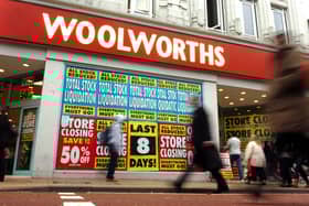 Posters cover the windows telling of Woolworths' closing down sale in 2008