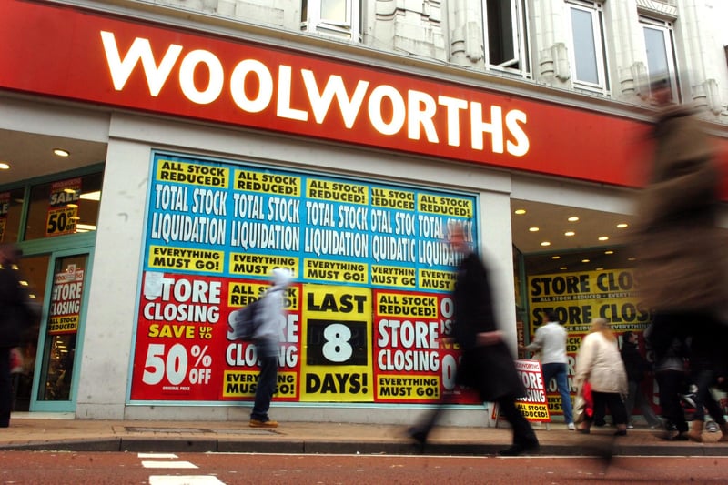 Posters cover the windows telling of Woolworths' closing down sale in 2008