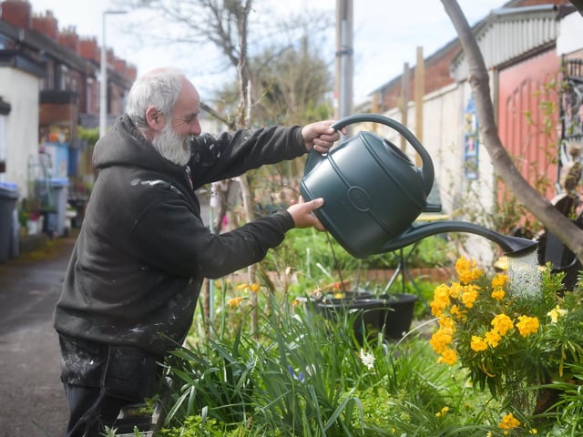 A group of residents have created a community garden in their alleyway called Strawberry Gardens. Pictured is Paul Ogden.