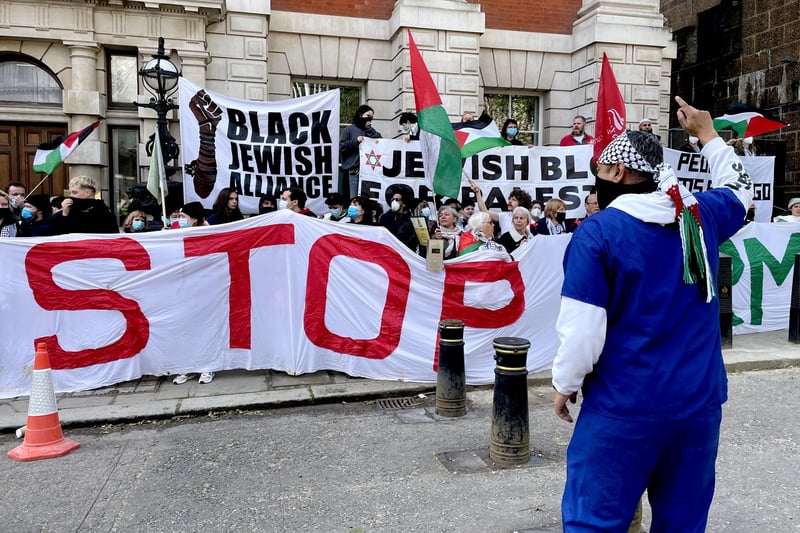 Protesters gather outside the Business and Trade department in London to show solidarity with Palestine, as they campaign against military arms being manufactured in the UK and sent to Israel.
