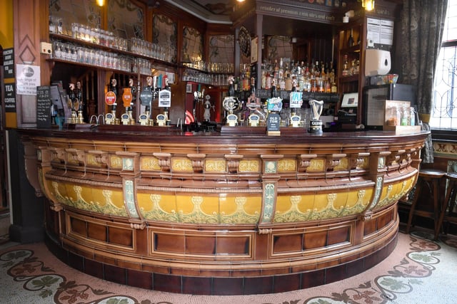 The Black Horse in Preston is probably one of the most well-known traditional pubs due to its unusual claim to fame. The grade II listed building is the only pub in England to have an entrance/exit on three different streets. And the interior is rather special too, featuring this stunning tiled bar, tiled walls and mosaic floor - and this is comes with national historical importance
