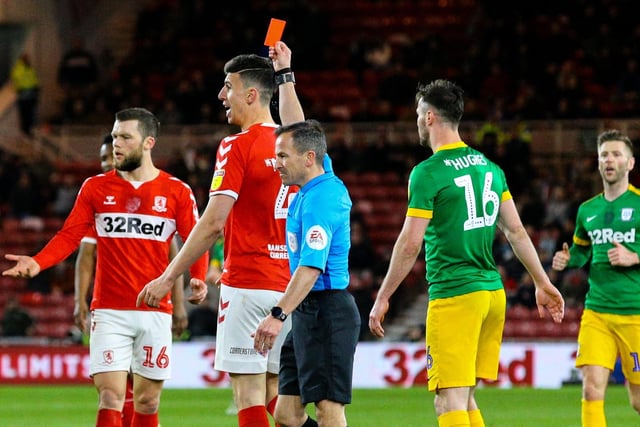 Referee Keith Stroud shows Middlesbrough's Daniel Ayala the red card.