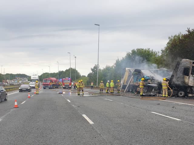 Fire crews working at the scene of the lorry fire on the M6 in Preston this morning (Friday, July 29)