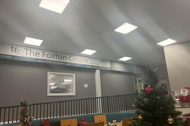 The Foxton Centre on Knowsley Street sign inside reads: 'We are here.'