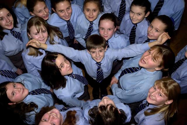 Sing when you're winning.....Christopher Thomas, 11, the only boy in the award winning Brownedge St Mary's RC High School choir from Bamber Bridge, near Preston. The choir were filmed by the BBC in preparation for them singing with Russell Watson