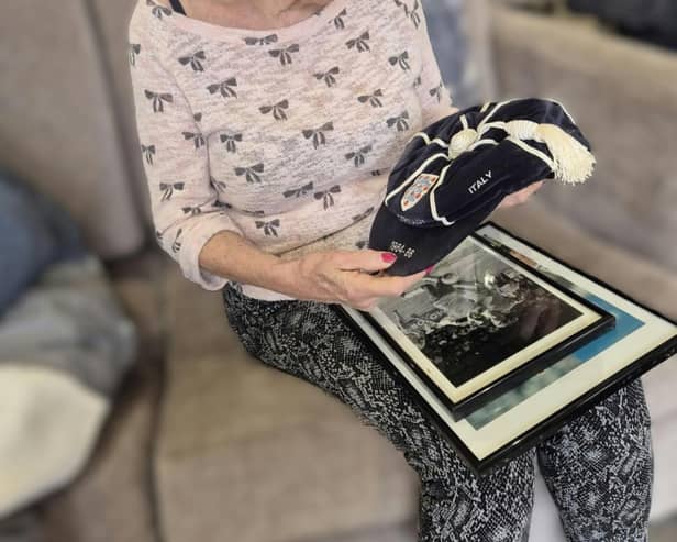 Residents admiring Paul Williams players cap and photo's