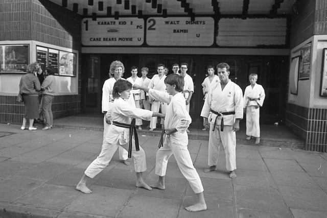 Cinema-goers had a touch of double-vision when they arrived for the latest martial arts film - The Karate Kid II. For the big screen action came to life... right outside Preston Odeon when members of the town karate club gave a demonstration outside. Pictured: Bob and Gwen Hitchen of Preston Karate Club during the demonstration