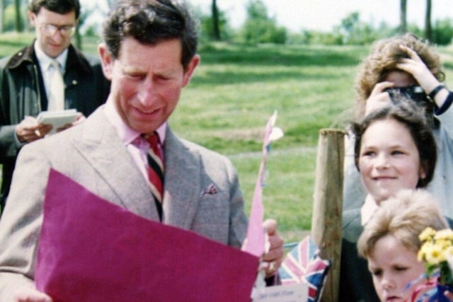 Prince Charles receives a get well card for Prince William from pupils of the former St. Saviour's Primary School, Bamber Bridge, 1991