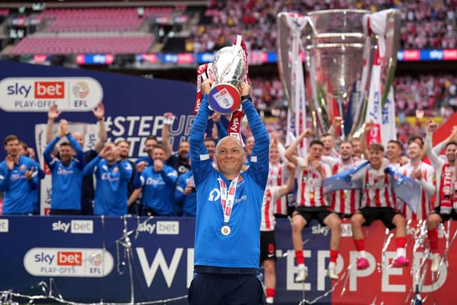 Sunderland manager Alex Neil celebrates with the trophy after the Sky Bet League One play-off final at Wembley Stadium
