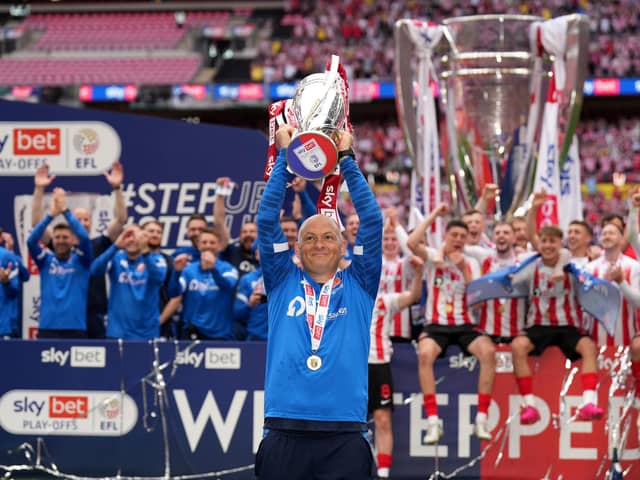 Sunderland manager Alex Neil celebrates with the trophy after the Sky Bet League One play-off final at Wembley Stadium