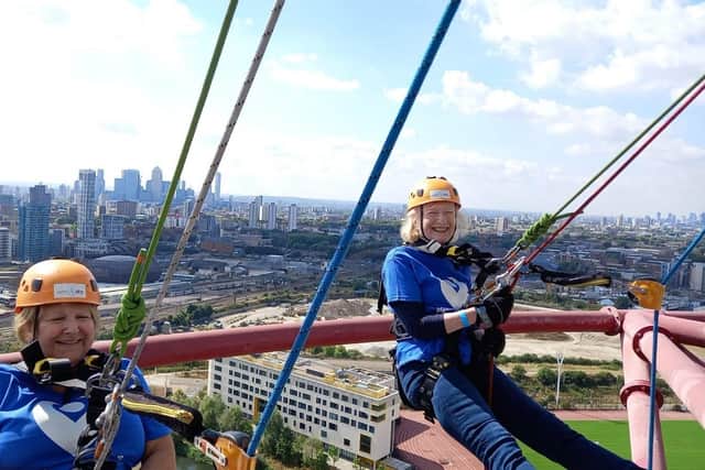 Lifelong friends Janice Harris, 61, from Coppull (far right) and her friend Julie Plaister abseiled down the ArcelorMittal Orbit in East London’s Queen Elizabeth Olympic Park last Saturday, raising nearly £2,000 for The Christie where Janice is being treated for throat cancer
