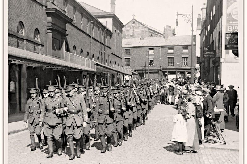 Fleet Street, Preston. August, 1914. The 4th Loyals, Preston's Territorials, march down Fleet Street on the way to the Railway Station. The regiment had been temporarily billetted at the Public Hall. The soldier in the front rank seen just to the right of the right hand leading officer is Private William Wilson. 