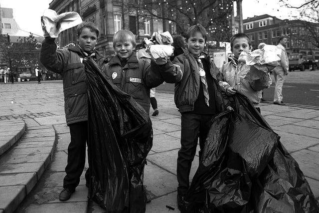 Scouts collect litter from the Flag Market for a pre-Christmas clear up