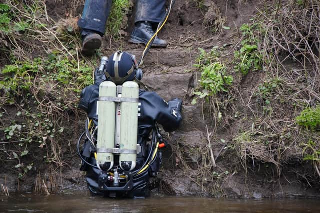 Almost a week after she was last seen, police cordoned off the bench as specialist divers return to search the river (Credit: Peter Byrne/ PA)