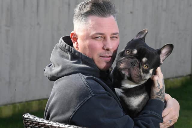 An ex gambling addict, he had been convicted of fraud in the past, but Paul says he has changed his life around for the better. Pictured with his dog Myles.