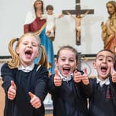 A thumbs up from pupils at Burnley's St Augustine's RC Primary School which has received a glowing report from the Catholic School's Inspectorate