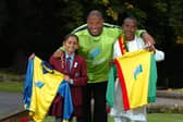 Football legend John Barnes hands over kit to Highfield Priory School pupil Shreya Chauhan and Binium Adisu of Score Ethiopia (Photo Neil Cross)