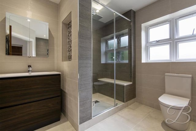 The family bathroom is spacious and stylish, featuring everything you would expect from such a contemporary home.