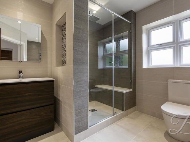 The family bathroom is spacious and stylish, featuring everything you would expect from such a contemporary home.