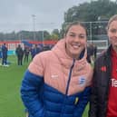 Aspiring goalkeeper Evie Mitchell with current England and Manchester United No.1 Mary Earps
