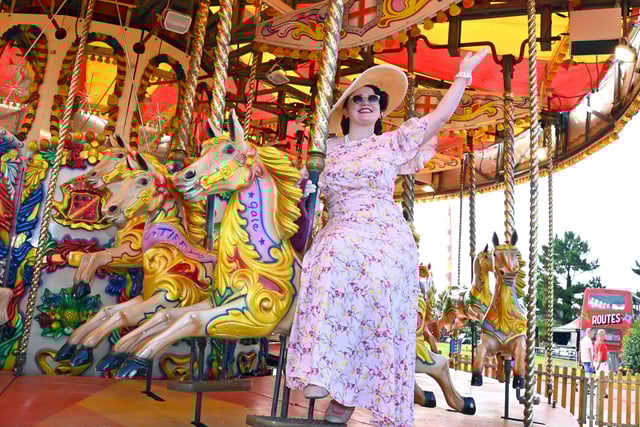 Vintage singer Hattie Bee on the carousel at the vintage festival in Morecambe.