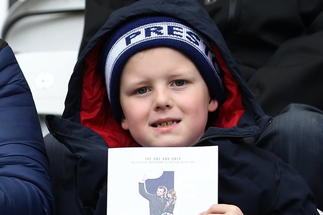 This young PNE fan holds up the official matchday programme