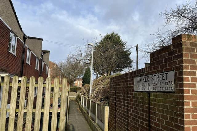 The victim was attacked and robbed after answering his door in Walker Street