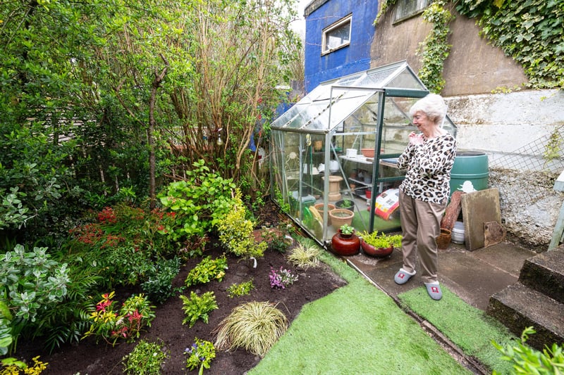Dorothy Rigby gets the first glimpse of her garden after it has been restored