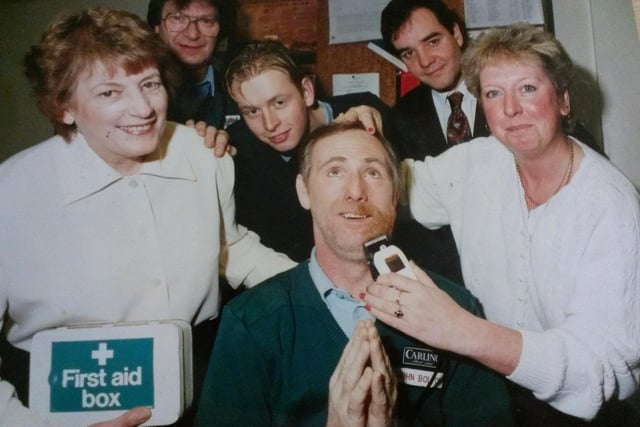 This boss gets his beard shaved off for Derian House. March 1991