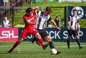 Chorley's Mike Calveley challenges for the ball against Darlington on Saturday (photo: Stefan Willoughby)